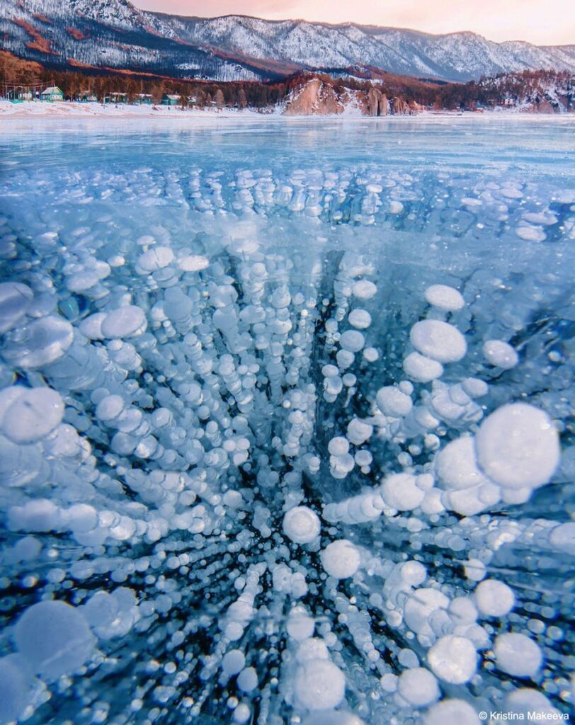 What are these bubbles frozen into Lake Baikal_ Methane. Lake Baikal, a UNESCO World Heritage Site in Russia, is the world's largest (by volume), oldest, and deepest lake